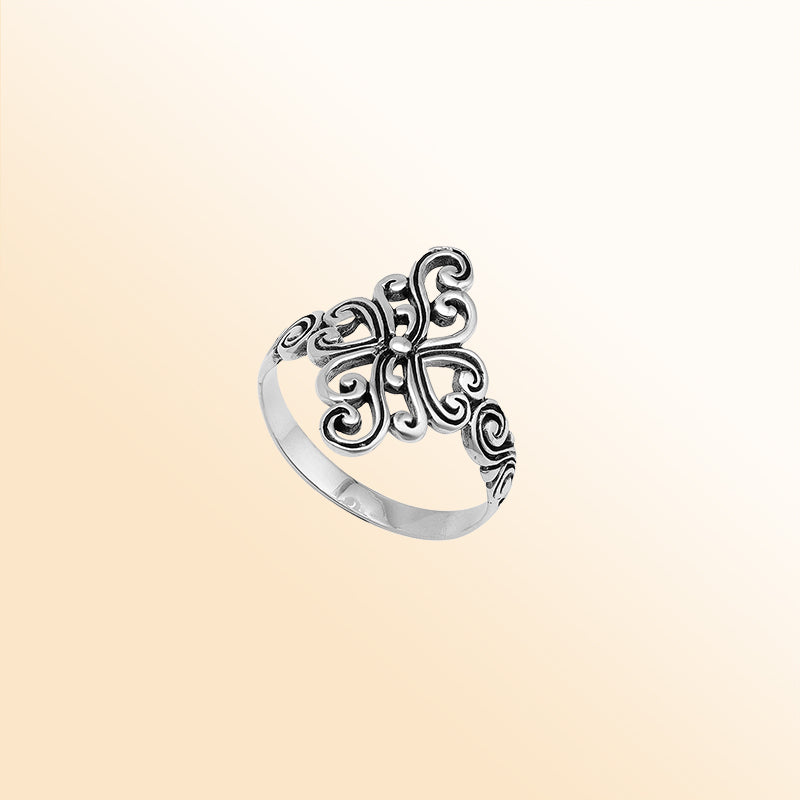 Sterling silver adjustable ring with elegant floral swirl design, handcrafted Balinese artisan jewelry for everyday wear.
