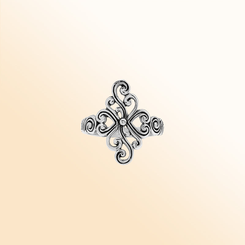 Sterling silver adjustable ring with elegant floral swirl design, handcrafted Balinese artisan jewelry for everyday wear.