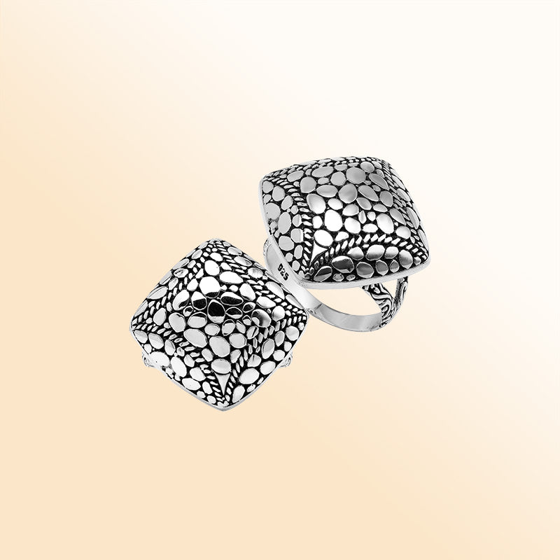 Sterling silver cushion dome ring with intricate Balinese dot design, handcrafted artisan statement jewelry.