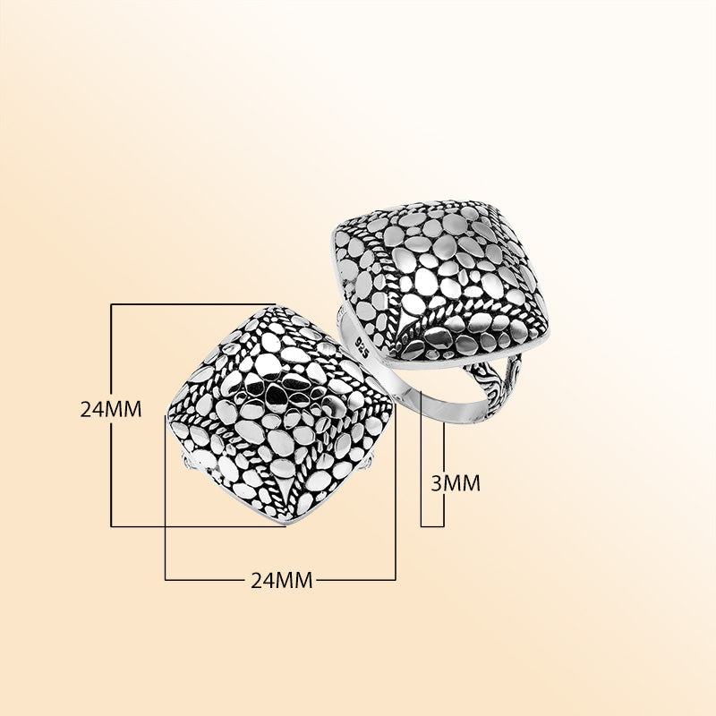 Sterling silver cushion dome ring with intricate Balinese dot design, handcrafted artisan statement jewelry.