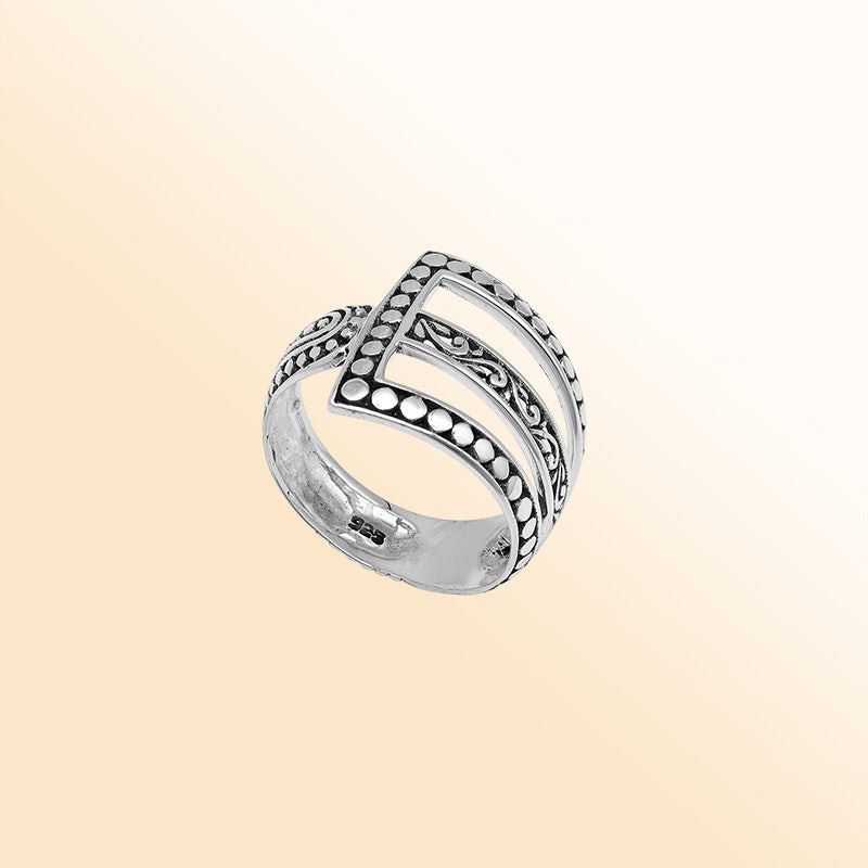 Handcrafted sterling silver geometric statement ring with openwork Balinese design and oxidized details – modern boho artisan jewelry for women.