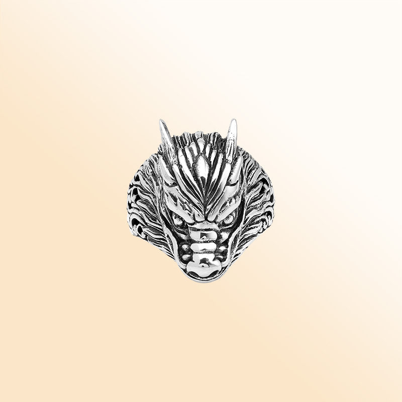 Handcrafted sterling silver dragon head statement ring with detailed Balinese carvings and oxidized finish – bold mythical artisan jewelry for men and women.