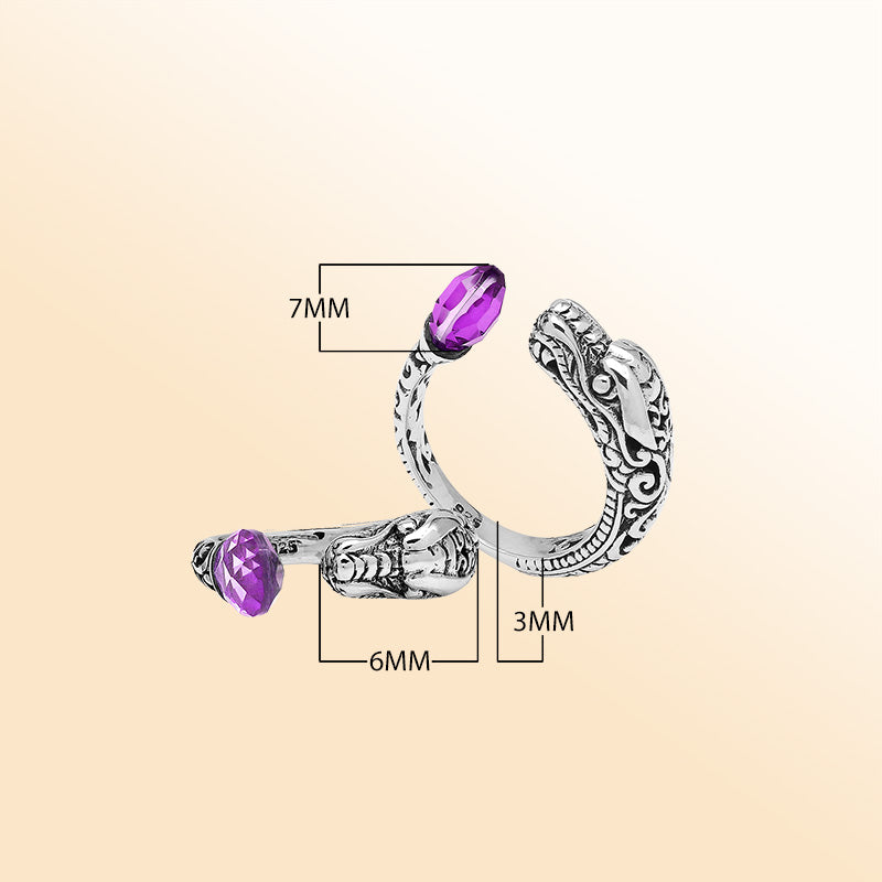 Handcrafted sterling silver dragon head ring with faceted Amethyst Quartz and detailed Balinese carvings – bold spiritual boho jewelry for women.