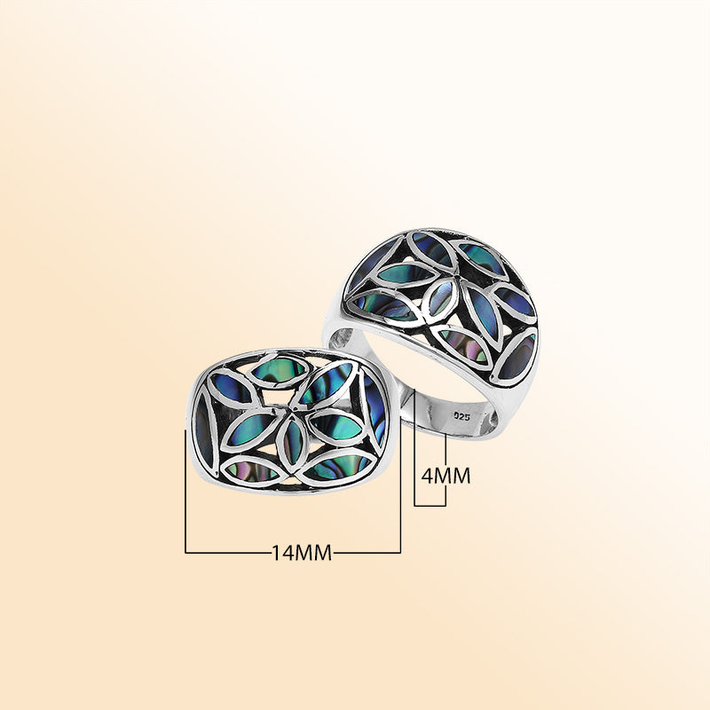 Handcrafted sterling silver wide band ring with shimmering Abalone Shell inlay, bold artisan jewelry inspired by ocean colors.