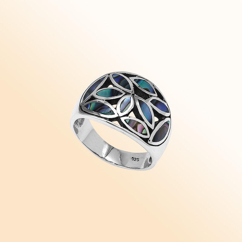 Handcrafted sterling silver wide band ring with shimmering Abalone Shell inlay, bold artisan jewelry inspired by ocean colors.