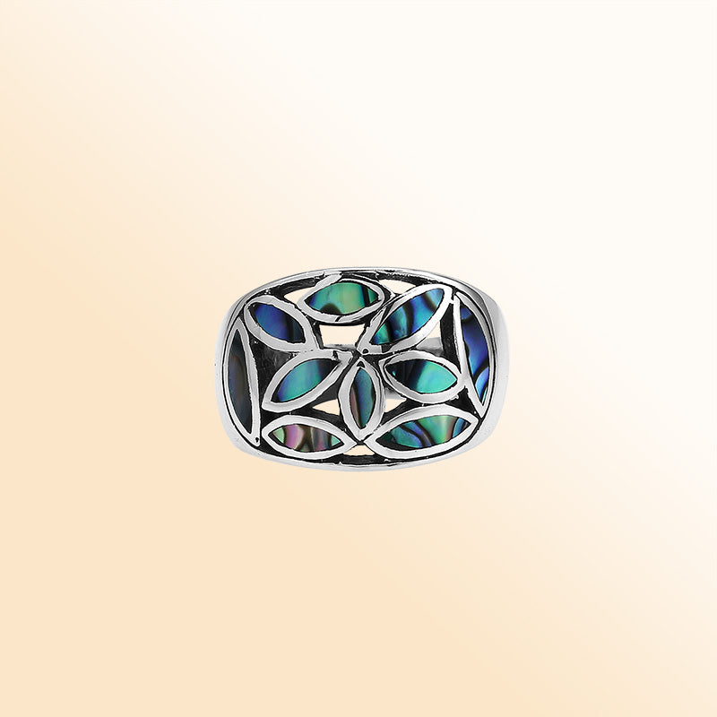 Handcrafted sterling silver wide band ring with shimmering Abalone Shell inlay, bold artisan jewelry inspired by ocean colors.