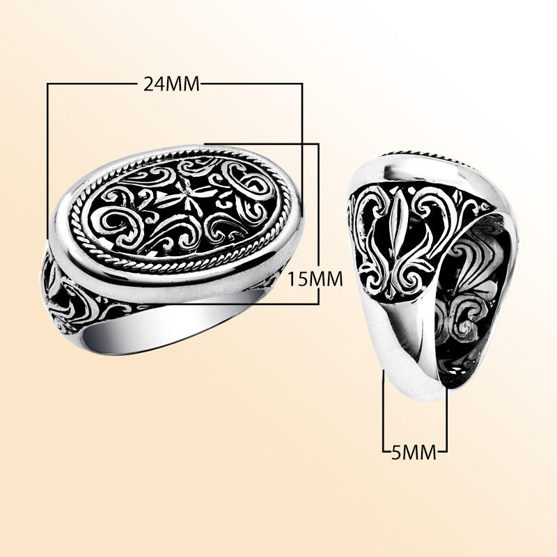 Woman sterling silver oval ring with intricate Bali carving and oxidized details, handcrafted 925 silver statement jewelry.