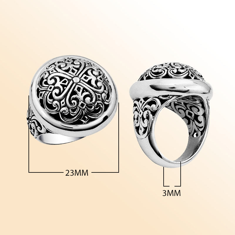 Sterling silver domed ring with intricate Bali carving, bold artisan statement jewelry for women.