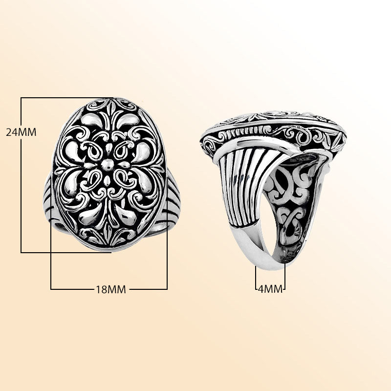 Handcrafted sterling silver oval floral ring with Balinese scroll detailing and oxidized finish, elegant artisan statement jewelry.