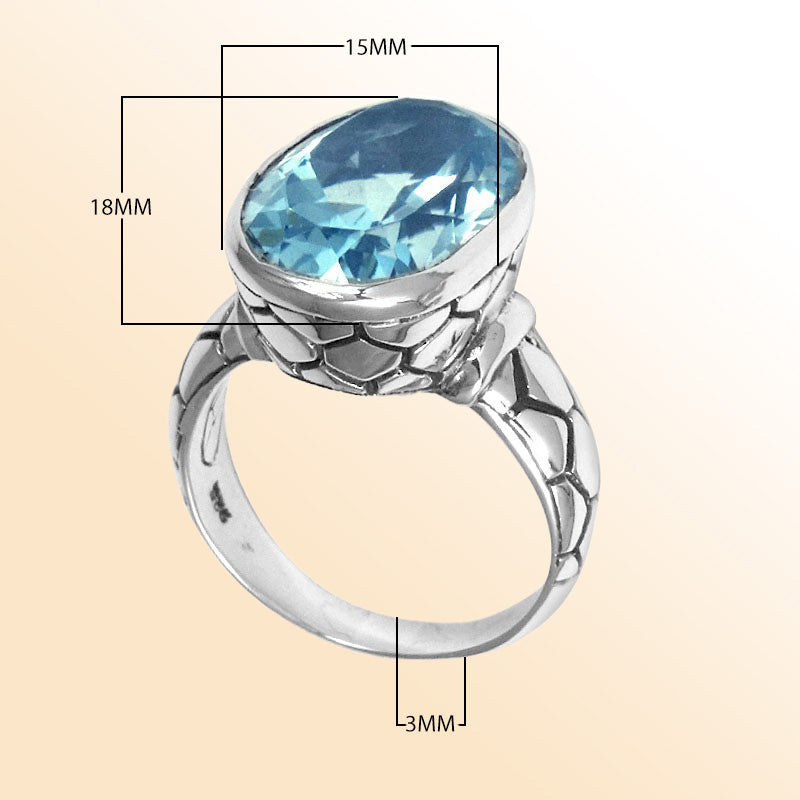 Handcrafted sterling silver ring with oval Blue Topaz Quartz and artisan carved band, made in Bali