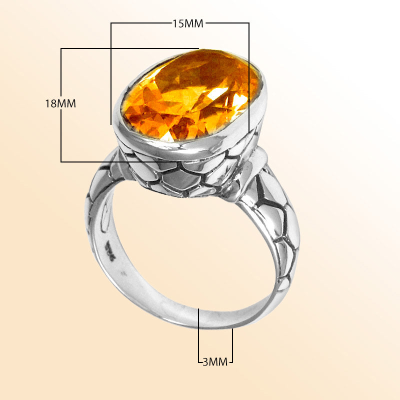 Handcrafted sterling silver ring with oval Citrine Quartz and artisan carved band, made in Bali.