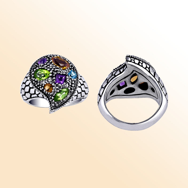 Handcrafted sterling silver swirl ring with colorful quartz—Amethyst Quartz, Peridot Quartz, Citrine Quartz, Blue Topaz Quartz, and Garnet Quartz— artisan-made in Bali.