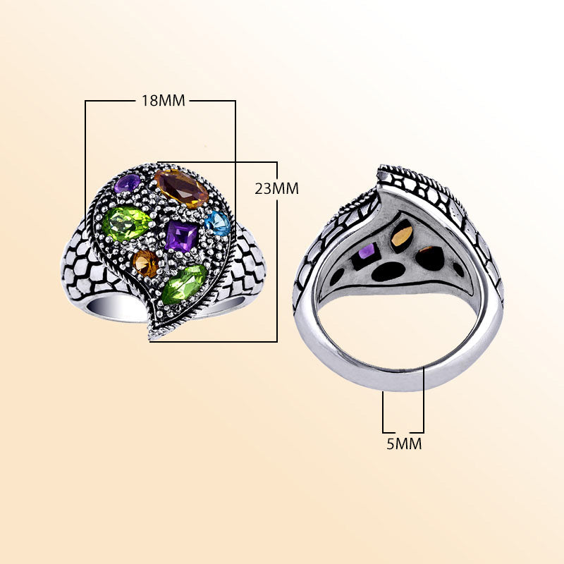 Handcrafted sterling silver swirl ring with colorful quartz—Amethyst Quartz, Peridot Quartz, Citrine Quartz, Blue Topaz Quartz, and Garnet Quartz— artisan-made in Bali.