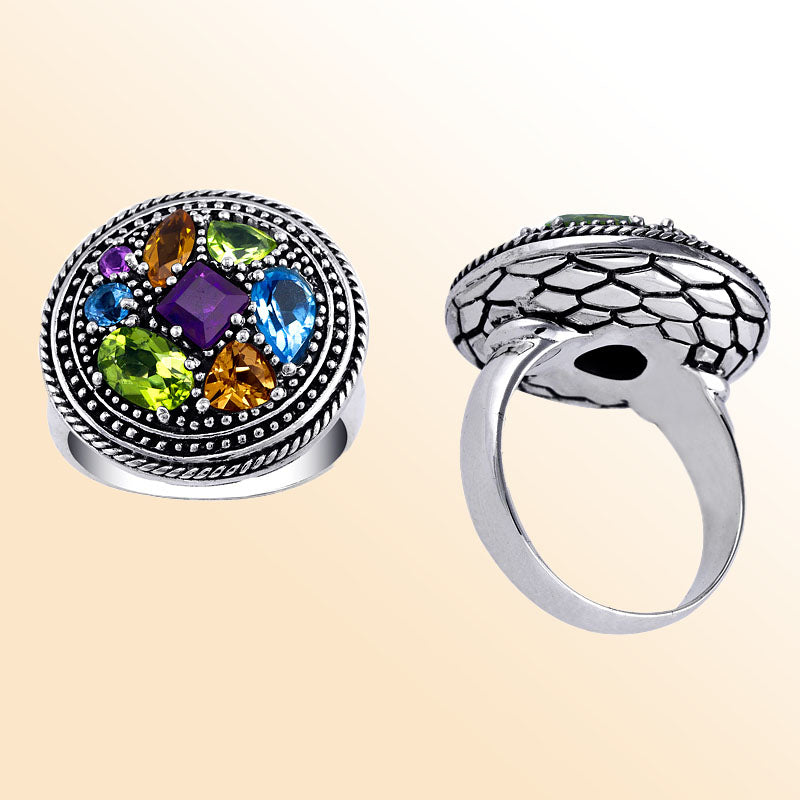 Sterling Silver multi quartz ring featuring Amethyst, Citrine, Blue Topaz, and Peridot Quartz in an elegant handcrafted statement design