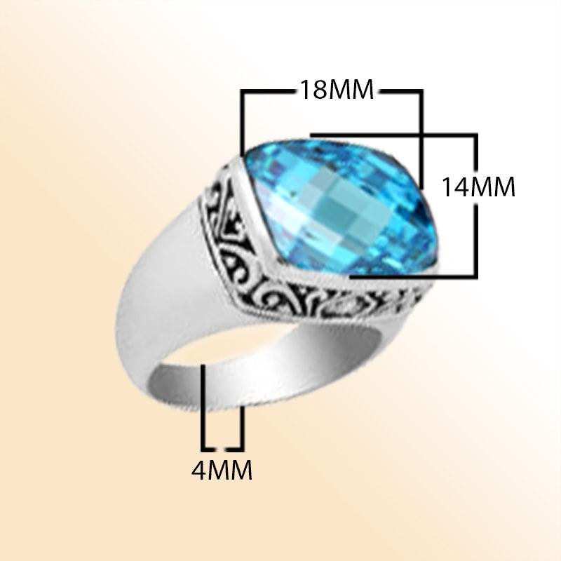 Sterling silver ring with a sparkling cushion-cut blue topaz  Quartz and delicate Balinese scroll details, handcrafted for a bold and elegant look.