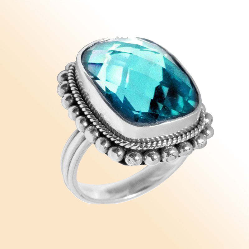 Sterling silver ring with sparkling cushion-cut blue Topaz Quartz, detailed rope bezel and beaded frame, handcrafted for elegant everyday or special occasion wear