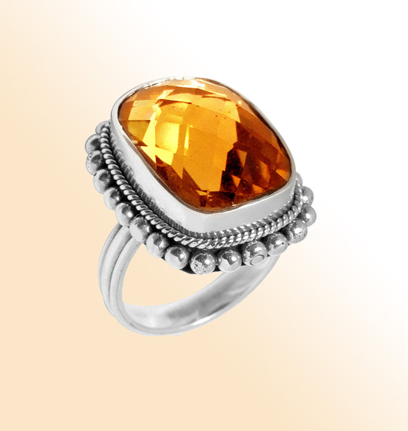 Sterling silver statement ring with cushion-cut golden citrine Quartz and Balinese beaded detailing, handcrafted for women’s jewelry collections.Inc 