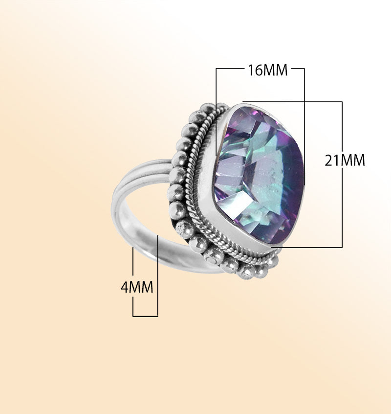 Sterling silver ring with faceted Mystic Topaz in purple, green, and blue hues – handcrafted Balinese statement jewelry.