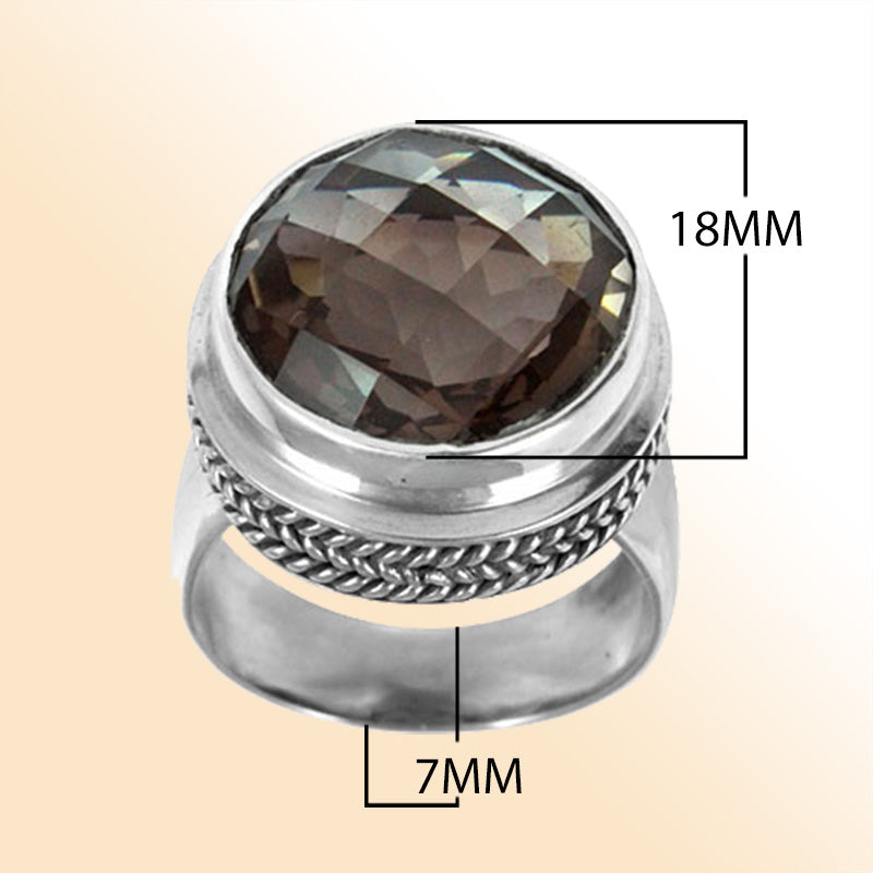 Sterling silver ring with a faceted smoky quartz and braided bezel detail, handcrafted in Bali for a bold artisan look.