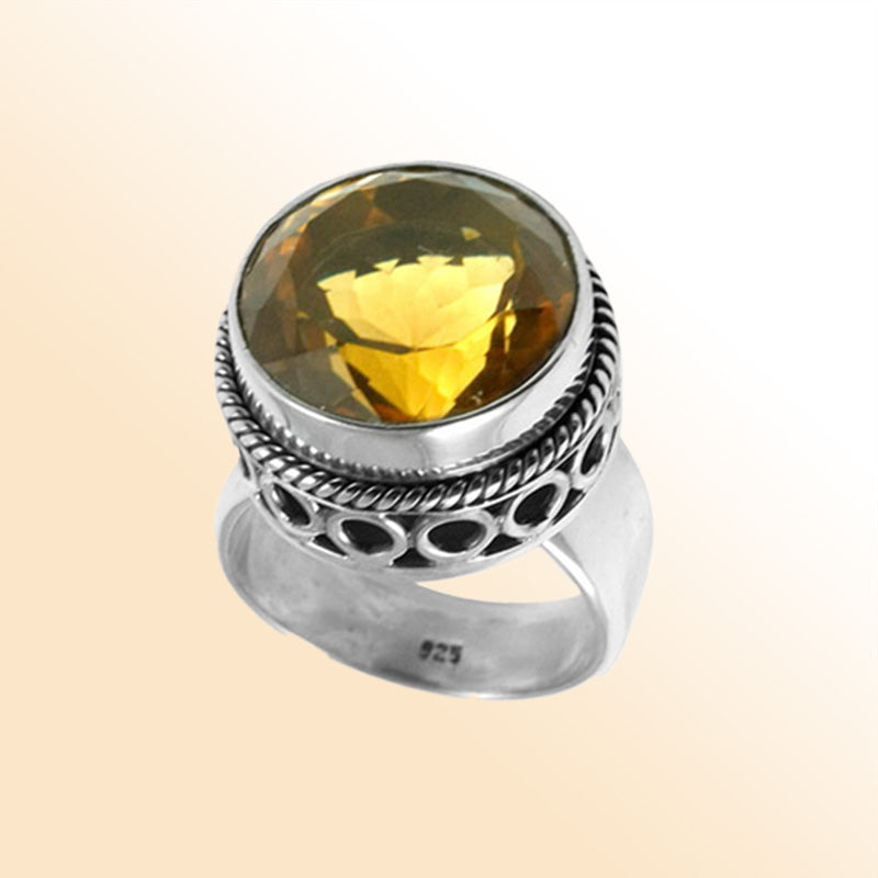 Sterling silver citrine ring with a faceted golden Quartz, rope bezel, and cutout band design, handcrafted in Bali for a bold artisan look.
