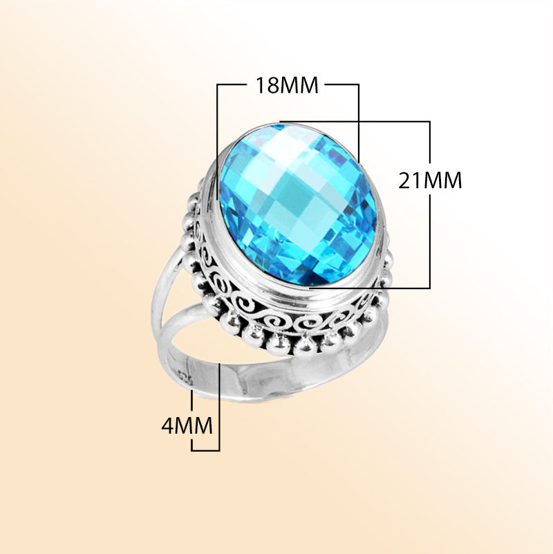 Sterling silver ring with faceted oval Blue Topaz Quartz, Balinese scroll and bead details – handcrafted artisan cocktail jewelry.