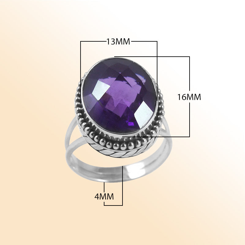 Sterling silver ring with faceted oval Amethyst Quartz and Balinese beaded details – handcrafted artisan cocktail jewelry.
