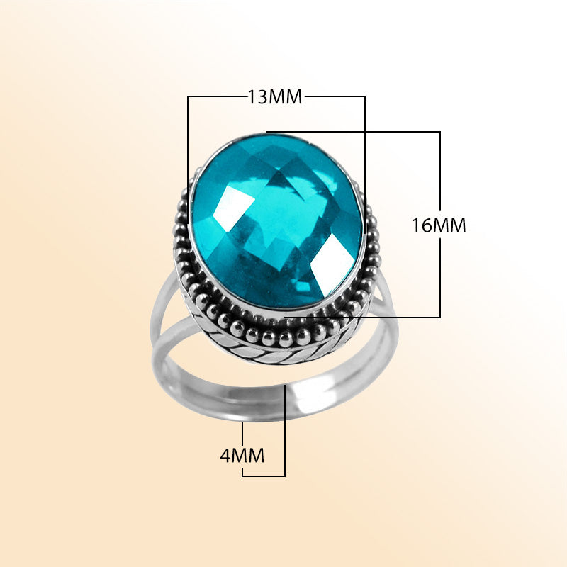 Sterling silver ring with faceted oval Blue Topaz Quartz and Balinese bead details – handcrafted artisan cocktail jewelry.