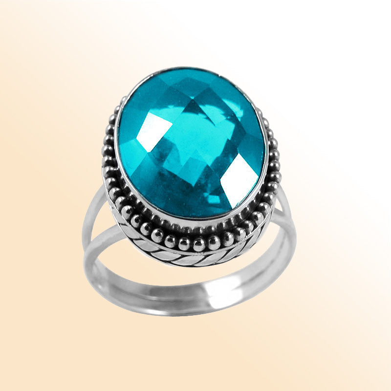 Sterling silver ring with faceted oval Blue Topaz Quartz and Balinese bead details – handcrafted artisan cocktail jewelry.