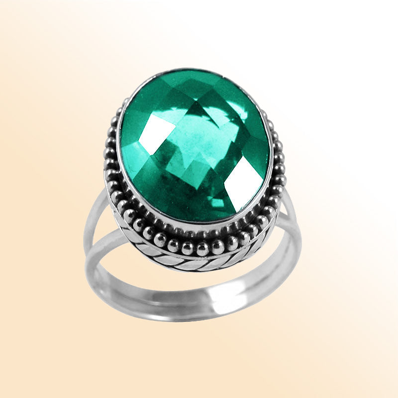 Sterling silver ring with faceted oval Green Quartz and Balinese bead details – handcrafted artisan cocktail jewelry.