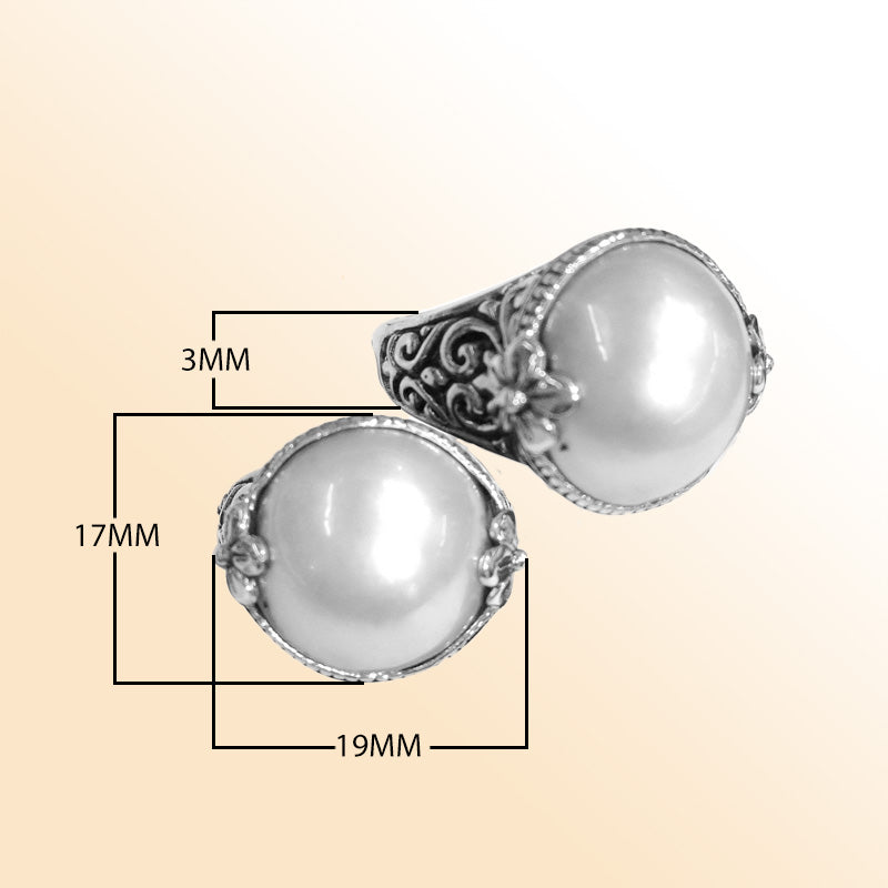 Sterling silver ring with radiant round Pearl and Balinese Floral scroll details – handcrafted artisan cocktail jewelry.