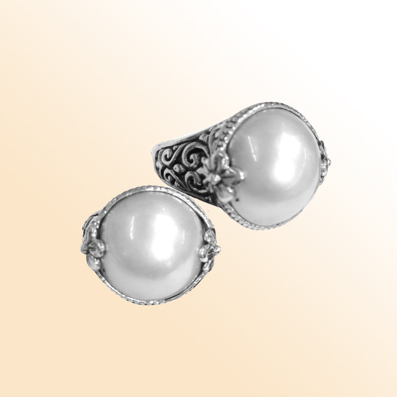 Sterling silver ring with radiant round Pearl and Balinese Floral scroll details – handcrafted artisan cocktail jewelry.