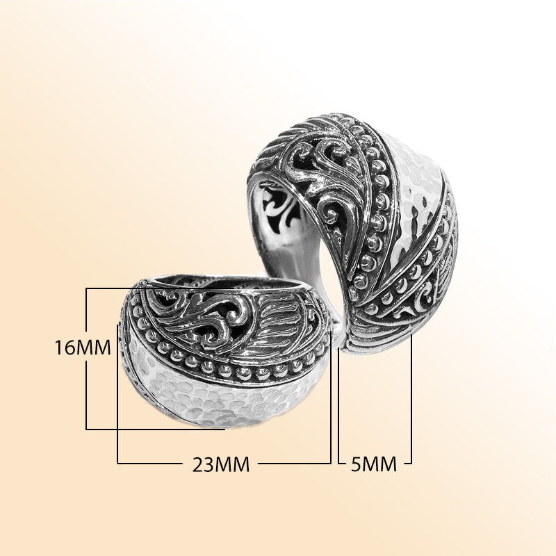 Handcrafted Balinese silver dome ring with hammered texture and scroll accents – unisex statement jewelry.