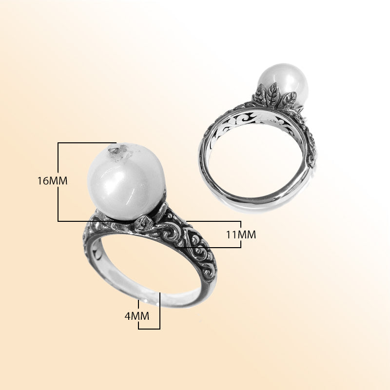 Elegant Balinese silver ring with white freshwater pearl and artisan scroll design.