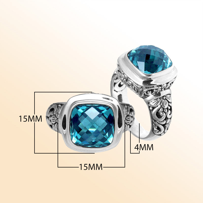 Handcrafted Bali silver ring with cushion-cut Blue Topaz Quartz and artisan carvings.
