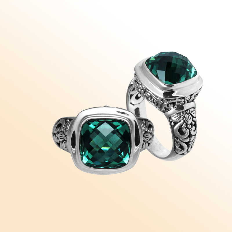 Handcrafted Bali silver ring with cushion-cut Green Quartz and artisan carvings.