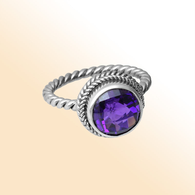 Handcrafted Bali silver ring with round Amethyst Quartz and rope-style band.
