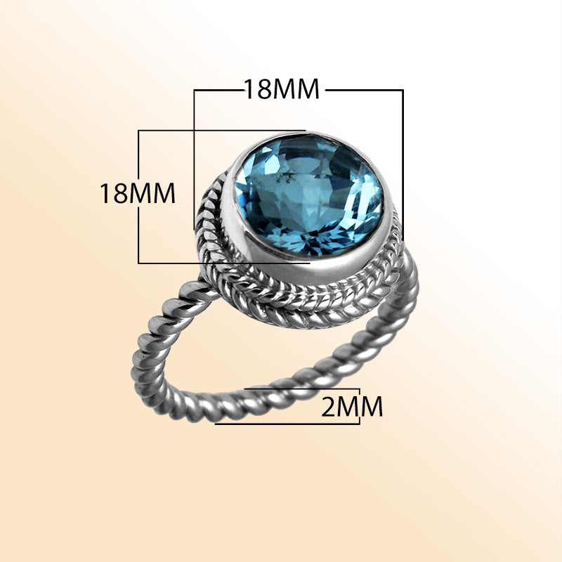 Handcrafted Bali silver ring with round Blue Topaz Quartz and rope-style band.