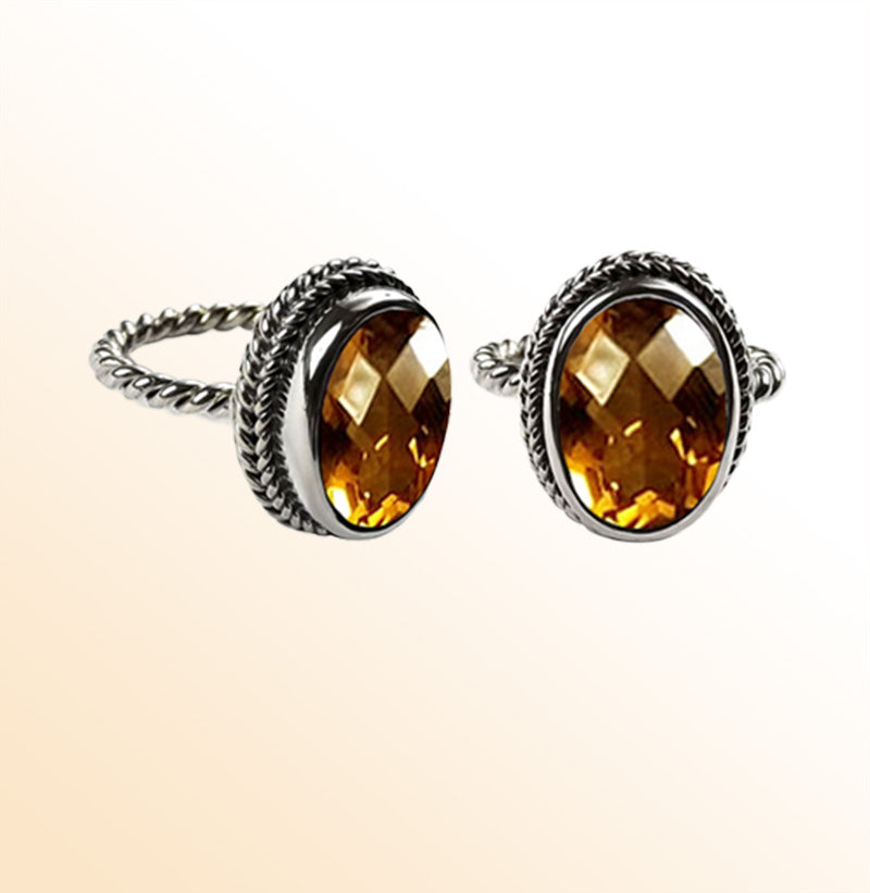 Handcrafted sterling silver Citrine Quartz ring with oval faceted Quartz and rope bezel, artisan jewelry from Indonesia.