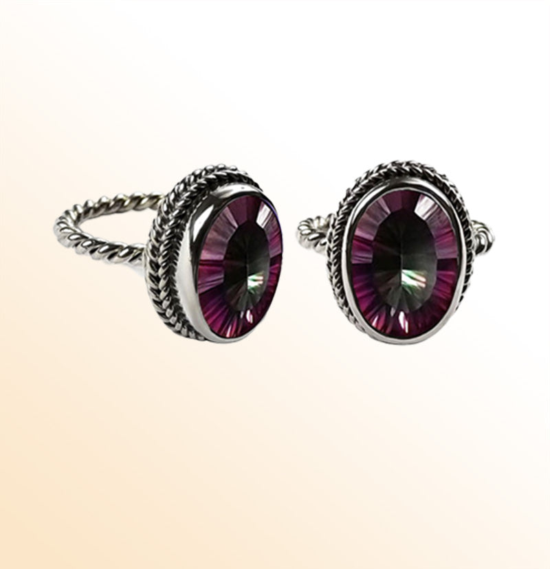 Handcrafted sterling silver Mystic Quartz ring with oval faceted multicolor Quartz and rope bezel, artisan jewelry from Indonesia.
