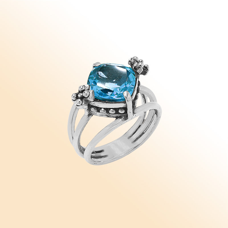Handmade sterling silver Blue Quartz ring with floral details and split shank, artisan Bali jewelry.