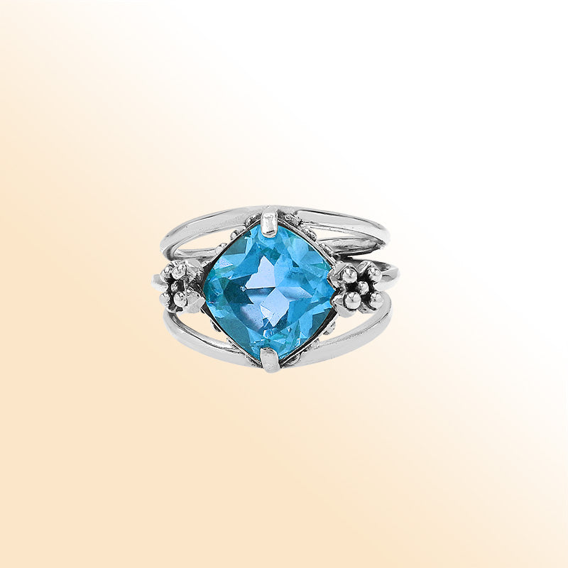 Handmade sterling silver Blue Quartz ring with floral details and split shank, artisan Bali jewelry.