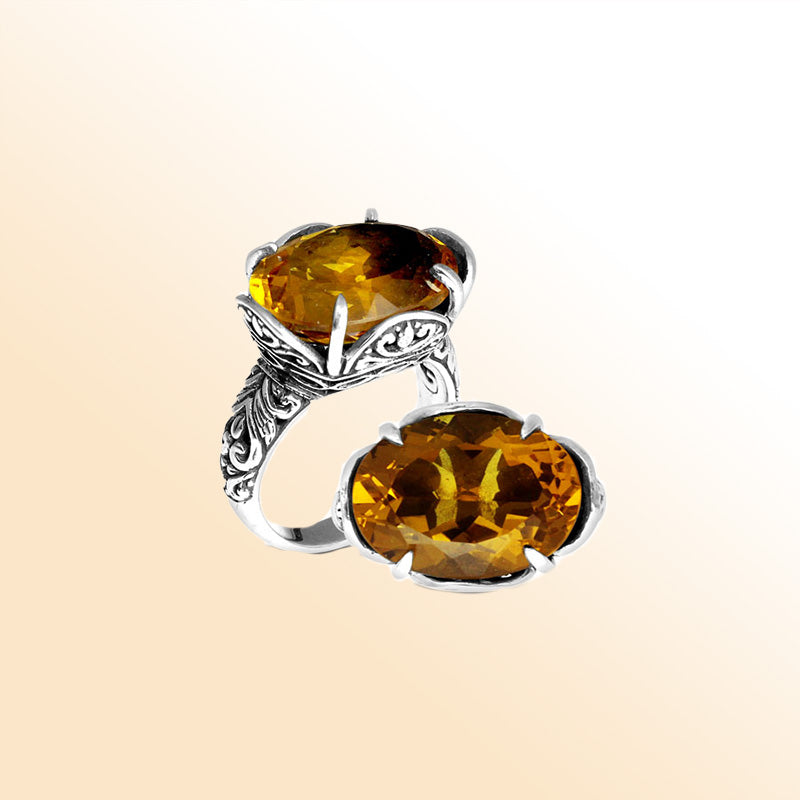 Handcrafted sterling silver Bali ring with oval golden Citrine Quartz and intricate carvings.