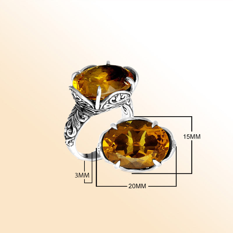 Handcrafted sterling silver Bali ring with oval golden Citrine Quartz and intricate carvings.