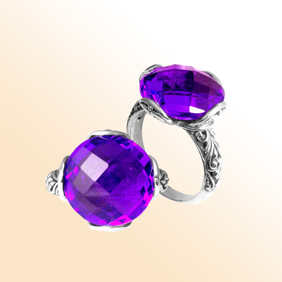 Handcrafted sterling silver Bali ring with faceted round Amethyst Quartz and scroll-carved band.
