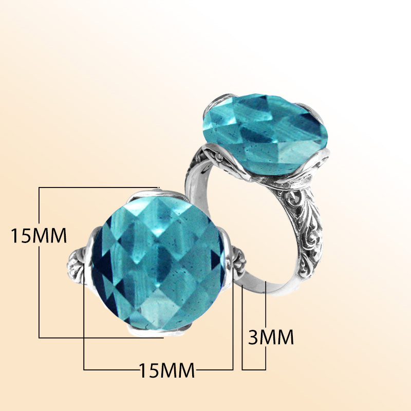 Handcrafted Bali sterling silver ring with faceted round Blue Topaz Quartz and scroll-carved band.