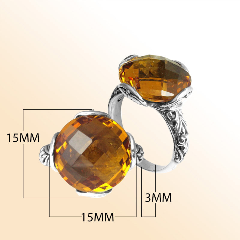 Handcrafted sterling silver Bali ring with faceted round Citrine Quartz and scroll-carved band.
