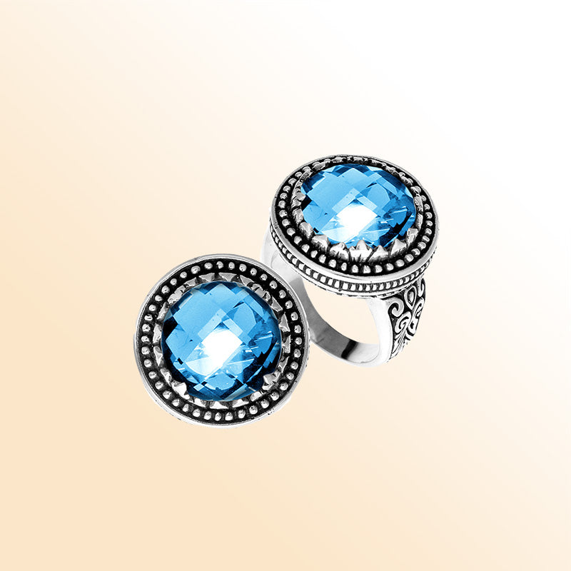 Handcrafted sterling silver Bali ring with faceted Blue Topaz Quartz and beaded halo design.