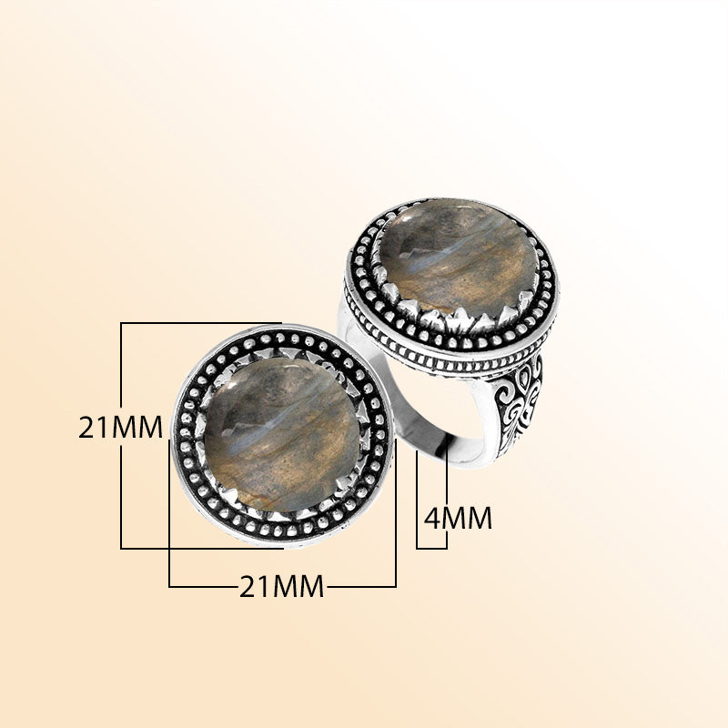 Handcrafted sterling silver Bali ring with Labradorite cabochon and beaded halo design.
