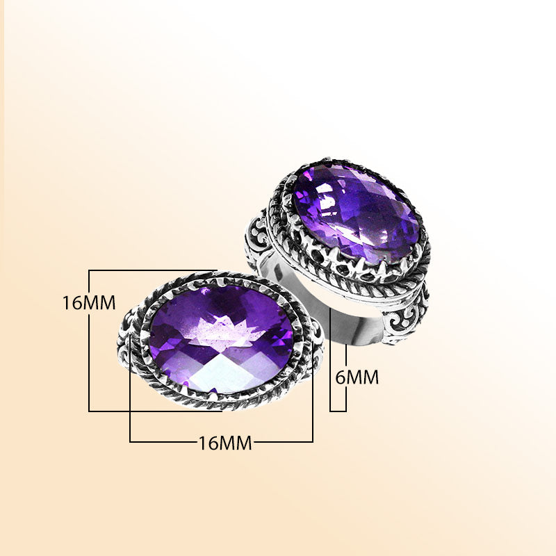 Handmade sterling silver Balinese ring with faceted Amethyst Quartz and detailed carvings.