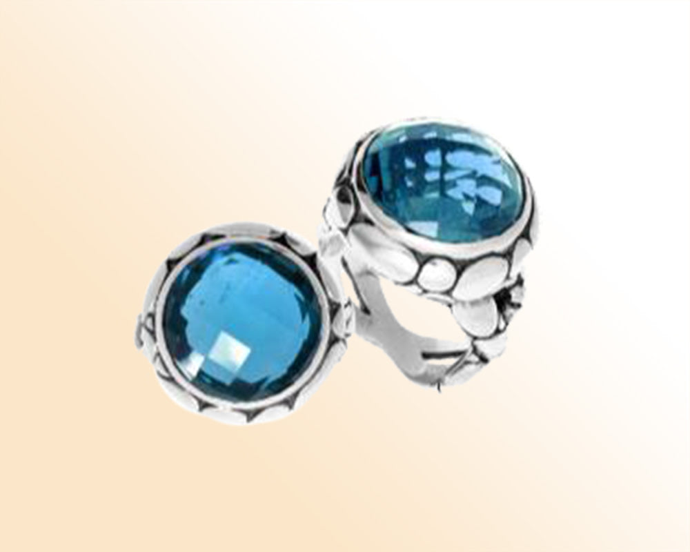 Handmade sterling silver Balinese ring with round-cut Blue Topaz Quartz in a bold bezel.
